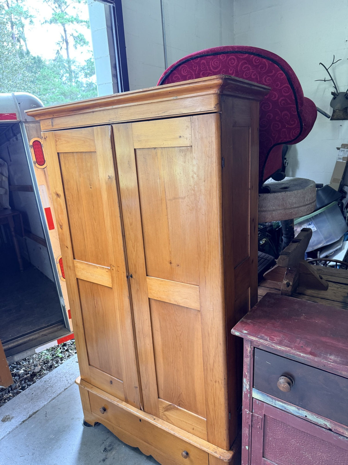Antique pine wardrobe, right side angle showing paneled side and drawer base