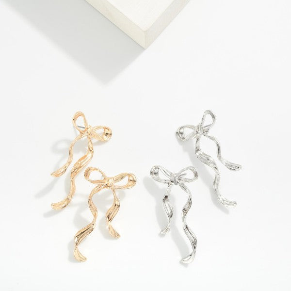 Textured Metal Long Bow Earrings Silver