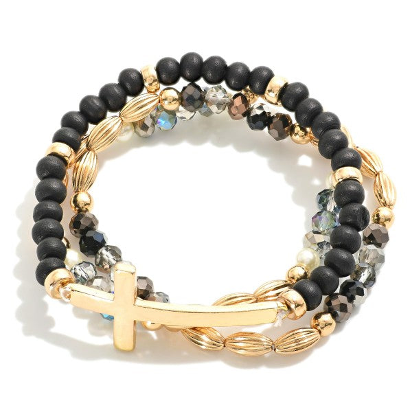 Set Of Three Beaded Stretch Bracelets Featuring Metal Tones, Wood Beads, East West Cross Black