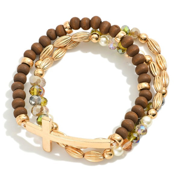 Set Of Three Beaded Stretch Bracelets Featuring Metal Tones, Wood Beads, East West Cross Brown