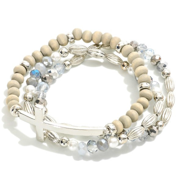 Set Of Three Beaded Stretch Bracelets Featuring Metal Tones, Wood Beads, East West Cross Gray