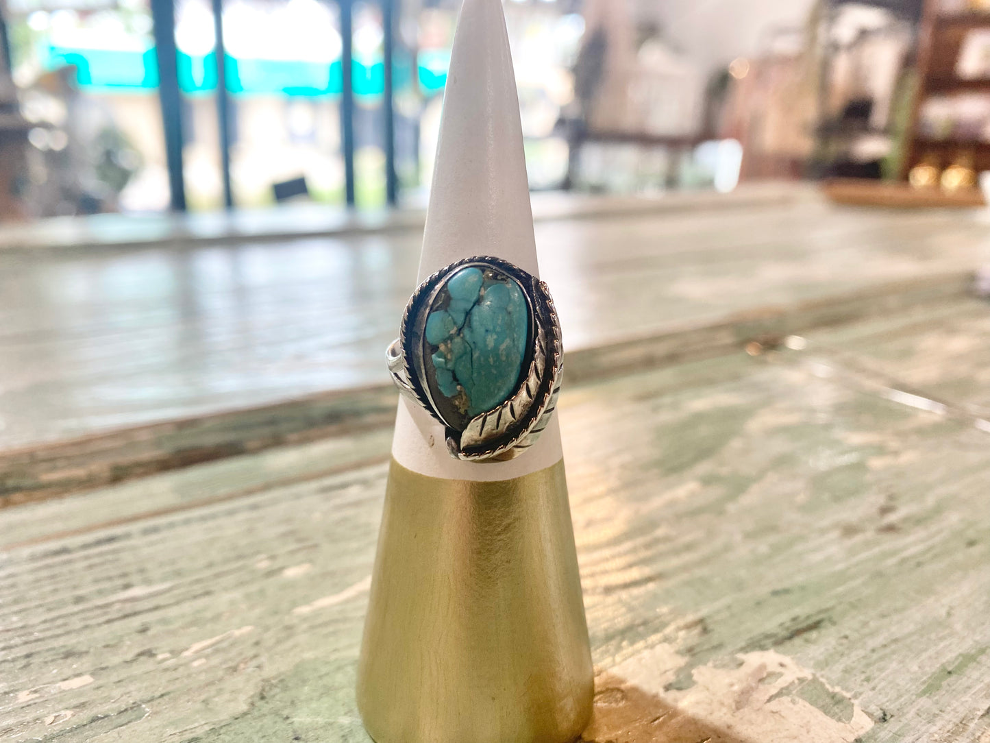 Vintage Navajo Ring with Turquoise, Feather, and Rope Around Edge
