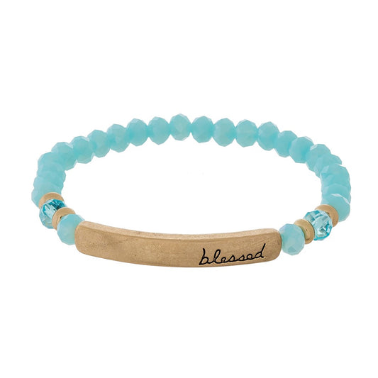 Beaded stretch bracelet with a bar focal, stamped with "blessed" Light Blue