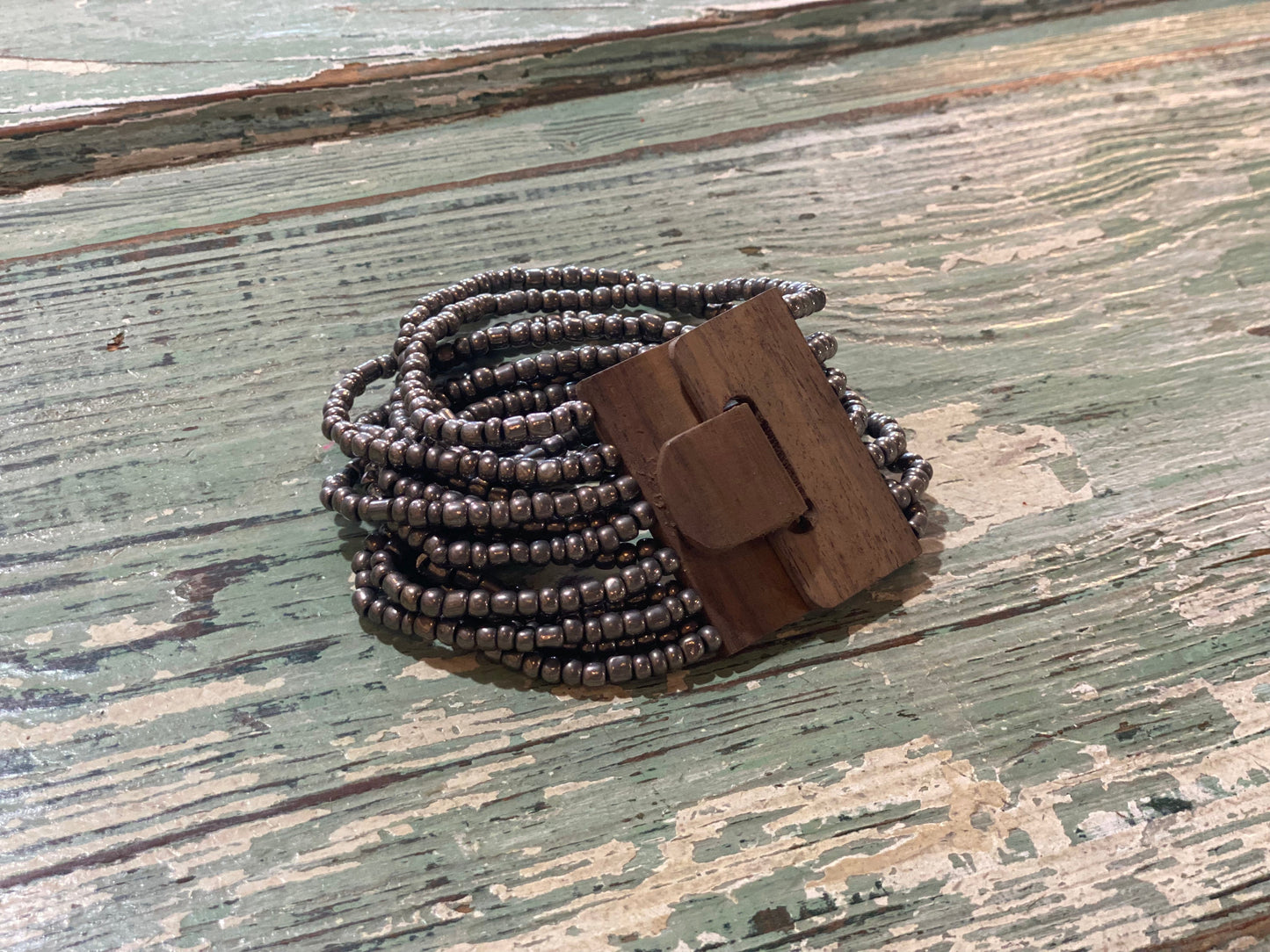 Beaded Strand Bracelet with Wood Clasp Metallic