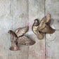 Pair of Bronze-Colored Soaring Doves
