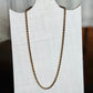 A twisted rope chain necklace in a bronze finish, displayed on a white fabric-covered jewelry bust.