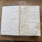 Two handwritten recipe cards on a wooden surface, one titled 'Coconut Noodle Soup' and the other titled 'Coconut Cookie'.