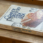 A vintage hardcover cookbook titled 'Complete Step-by-Step Cook Book' by Better Homes and Gardens, resting on a wooden surface.