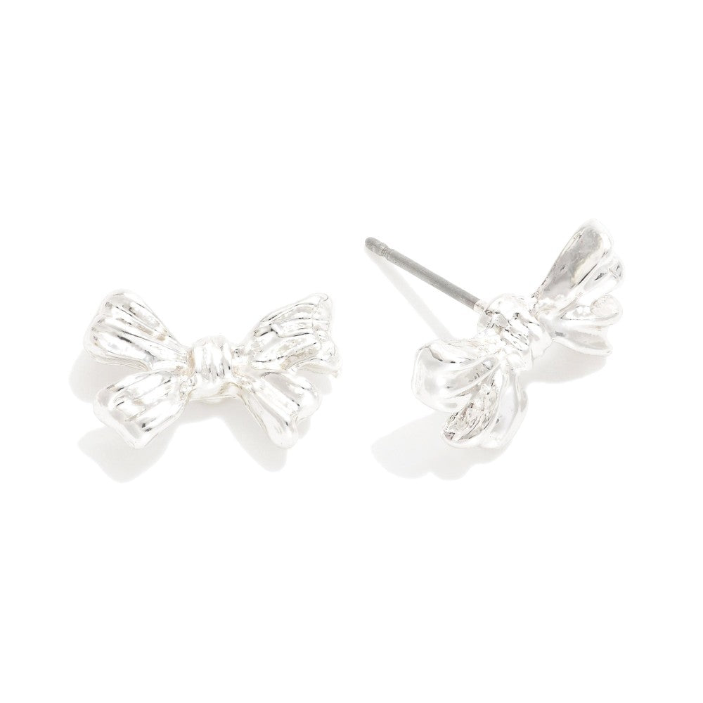 Silver bow-shaped earrings on a white background