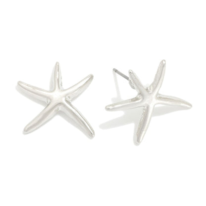 Silver starfish earrings on a white background