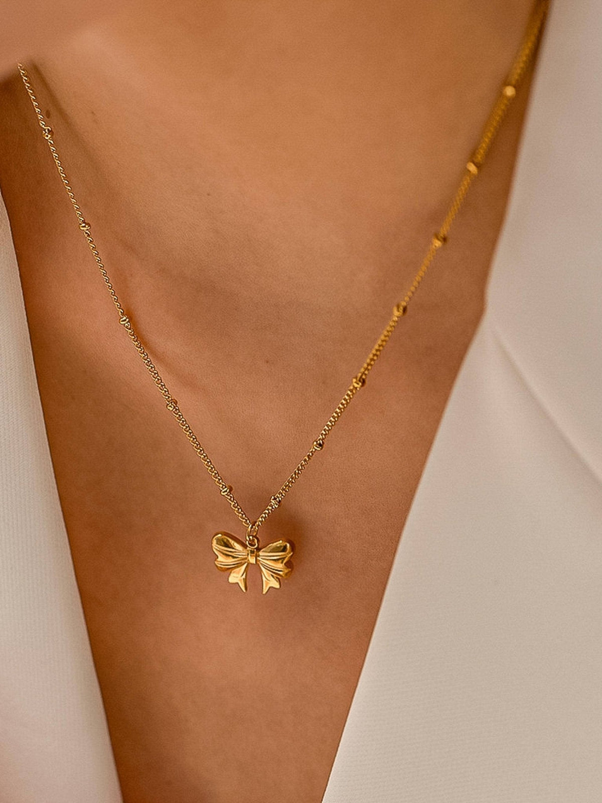 Alannah 18K Gold Non-Tarnish Bow Necklace: Yellow Gold - The Mustard Seed Collection, The Seed