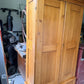 Antique pine wardrobe, left side angle showing paneled side and cornice