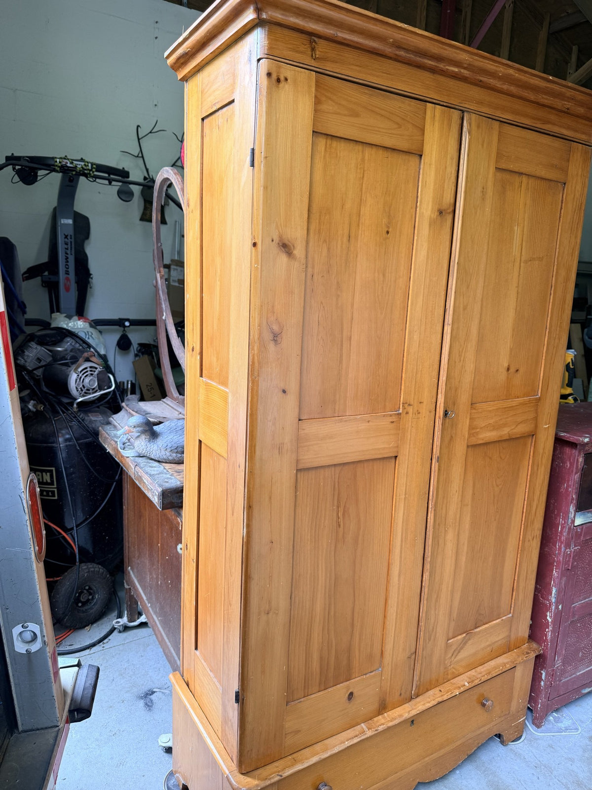 Antique pine wardrobe, left side angle showing paneled side and cornice