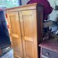 Antique pine wardrobe, right side angle showing paneled side and drawer base