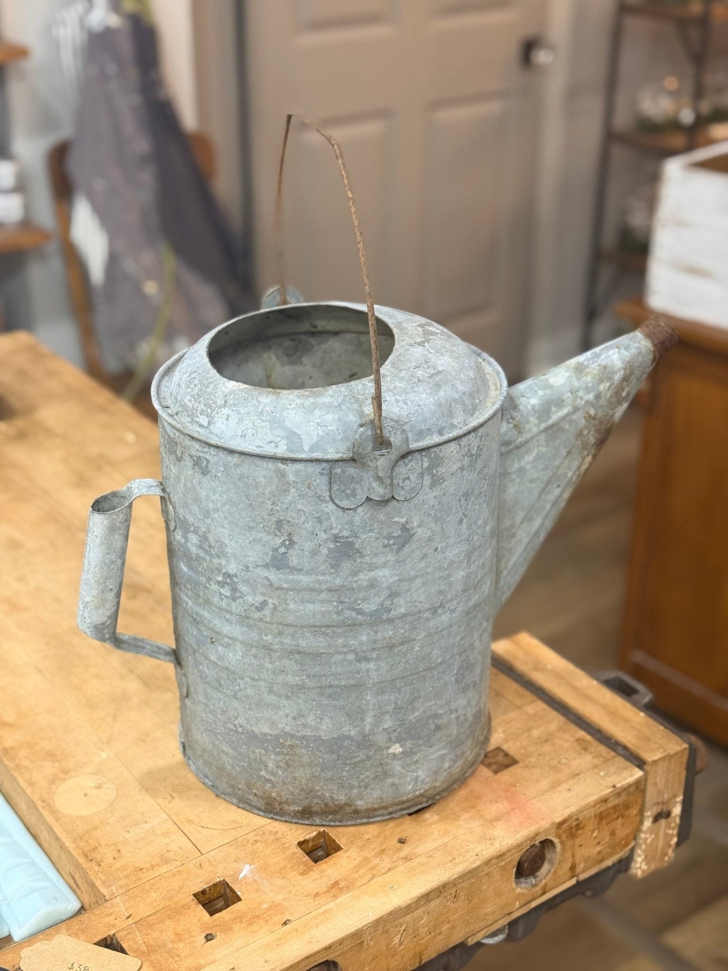 Galvanized Watering Can with dent 