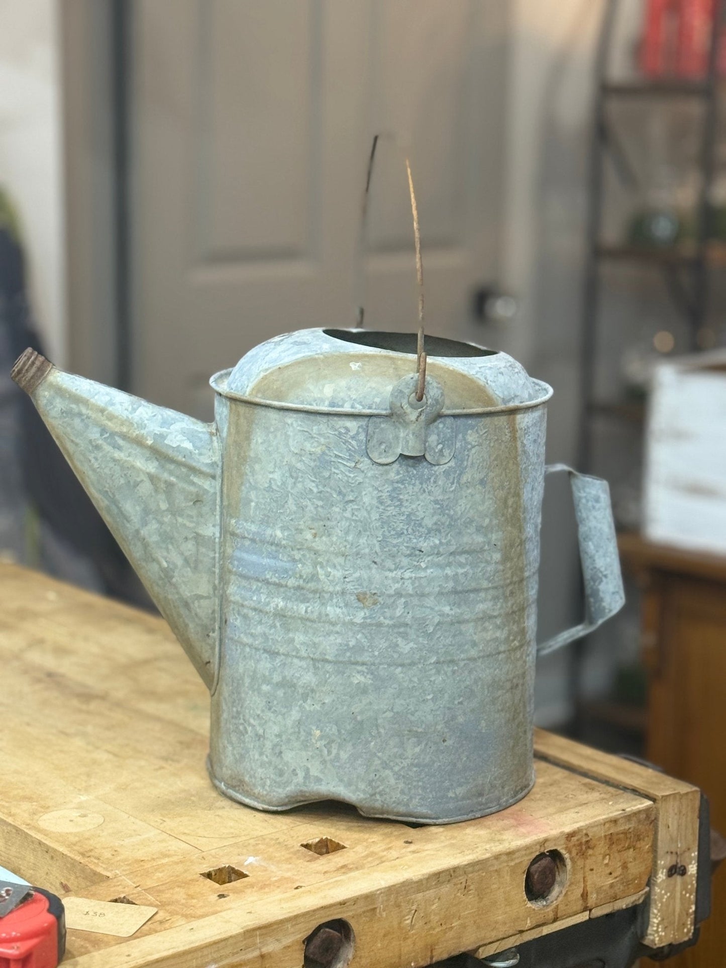 Galvanized Watering Can with dent 