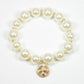 Hammered round charm pearl stretch bracelet: Worn gold/Cream pearl / ONE SIZE