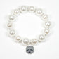 Hammered round charm pearl stretch bracelet: Worn gold/Cream pearl / ONE SIZE