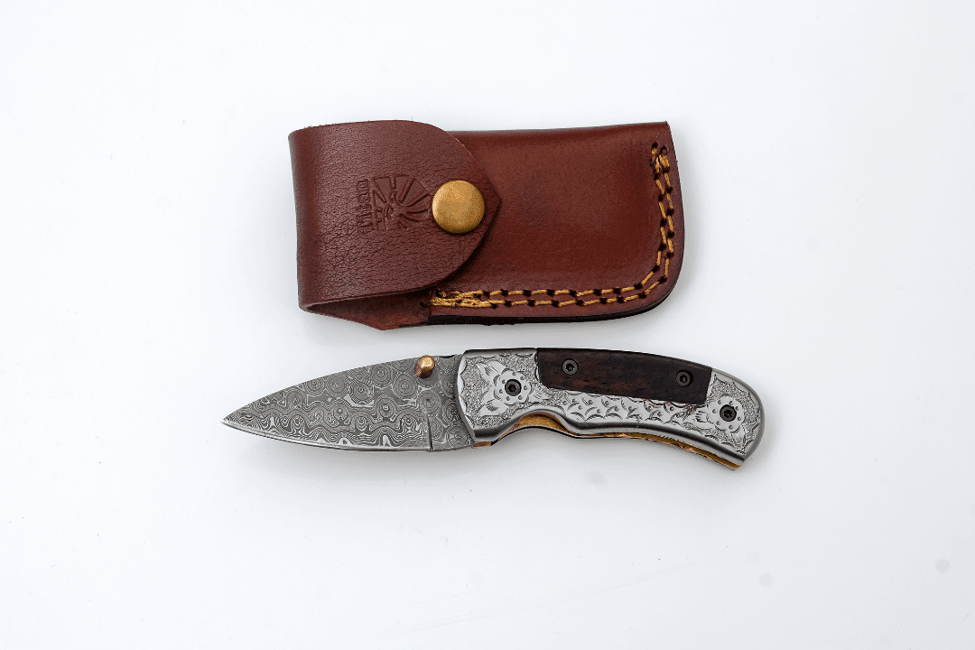 Hand-Forged Damascus Folding Knife | Engraved Bolster, Dark Wood Handle & Intricate Spine File Work - The Mustard Seed Collection, The Seed