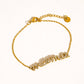 Lolana 18K Gold Non-Tarnish CZ Mama Script Bracelet: Yellow Gold - The Mustard Seed Collection, The Seed