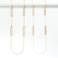 Long Metal Chain Link Necklace Featuring Laser Cut Flower Bar Charms
