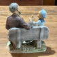 Norleans Japan Man on Bench with Boy Figure - The Mustard Seed Collection, The Seed