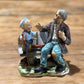 Norleans Japan Man on Bench with Boy Figure - The Mustard Seed Collection, The Seed