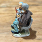 Norleans Japan Man on Bench with Boy Figure - The Mustard Seed Collection, The Seed