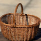 Oval Woven Basket with Twisted Handle - The Mustard Seed Collection, The Seed