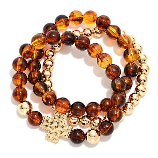 Set Of Three Beaded Stretch Bracelets Featuring Acetate Tortoise Beads, Metal Tones, & Plus Cross Station 